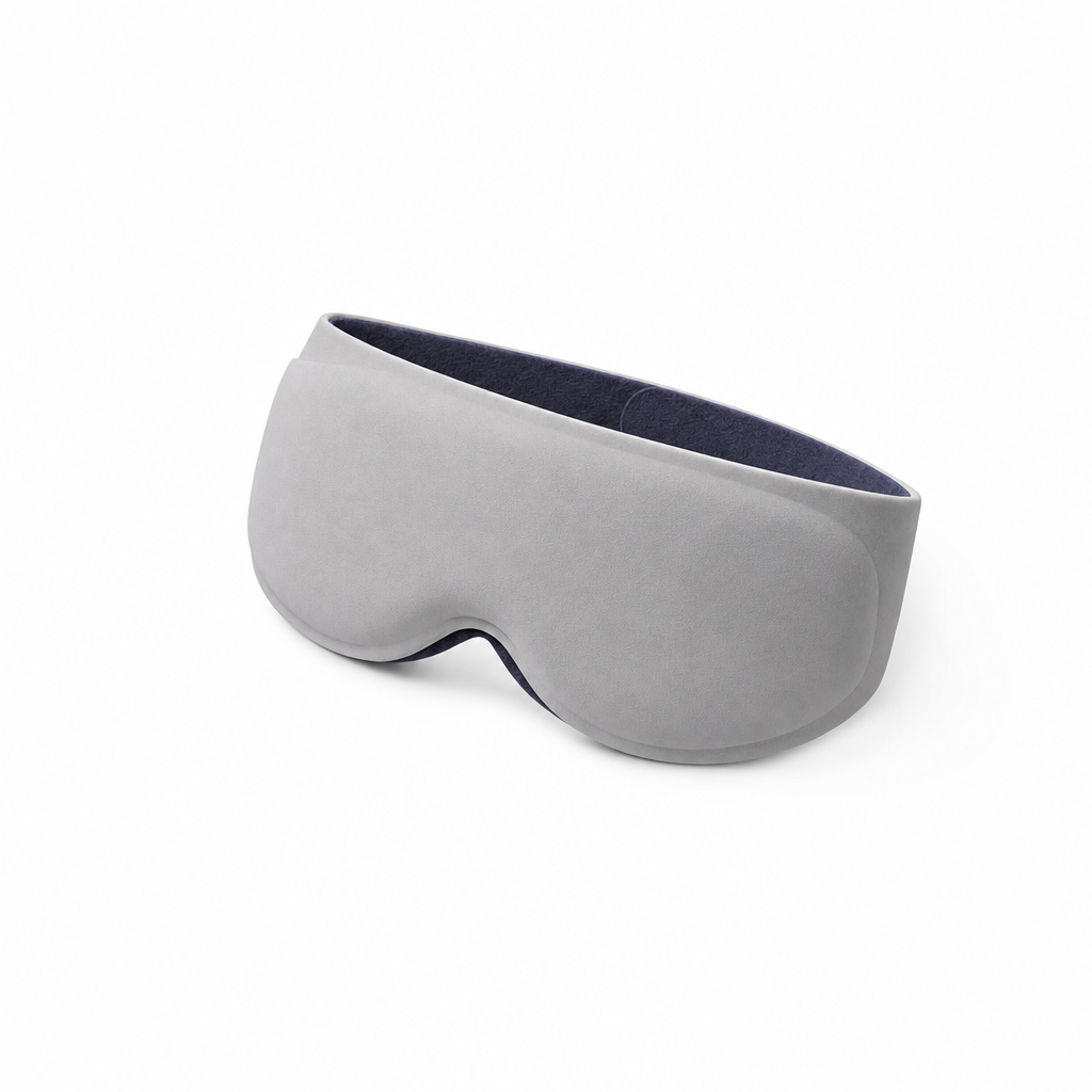 The Eclipse contoured weighted sleep mask in Stone Gray, three-quarter studio view
