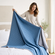 Woman holding The Breeze up to show how thin and fluid it drapes