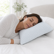 Woman asleep on her side with her head supported on The Cloud pillow