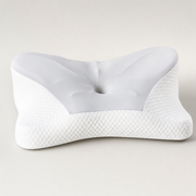 The Aligned butterfly cervical contour memory foam pillow, three-quarter studio view